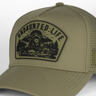 closeup of Green hat with UNDAUNTED LIFE patch